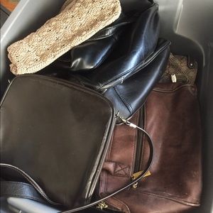 Three tubs of used purses